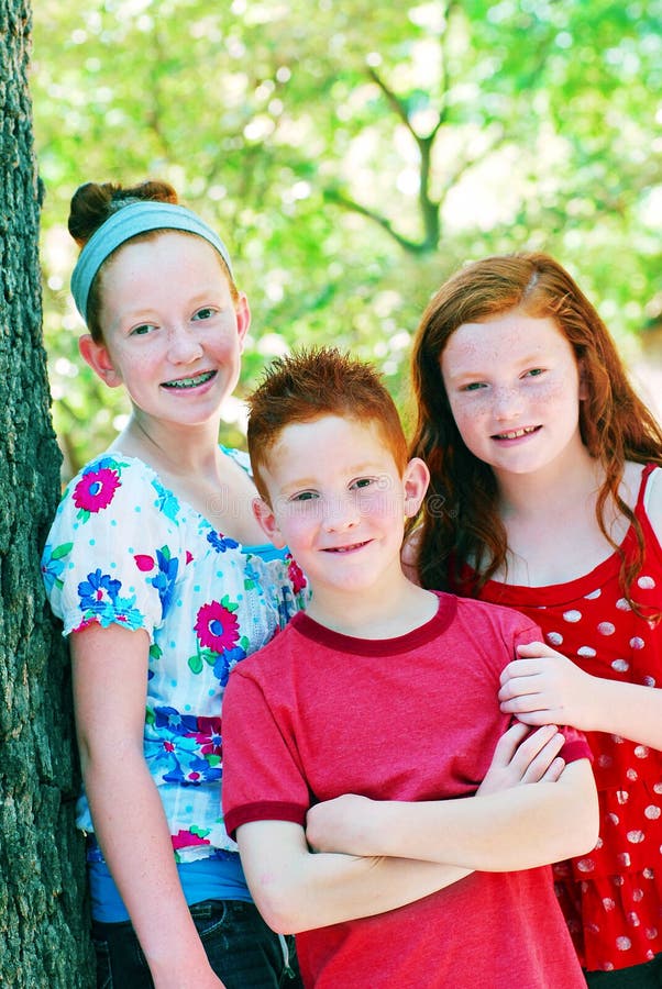 Three siblings outdoors royalty free stock images Three siblings outdoors royalty free stock images