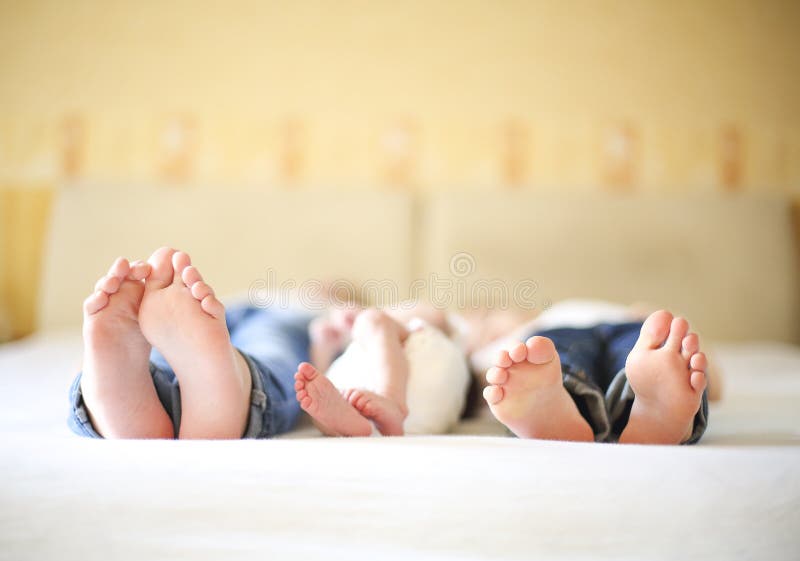 Three sisters, close up on feet. Holiday and happiness concept