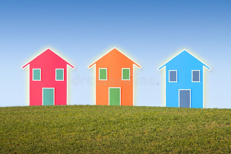 Three small isolated houses on a hill