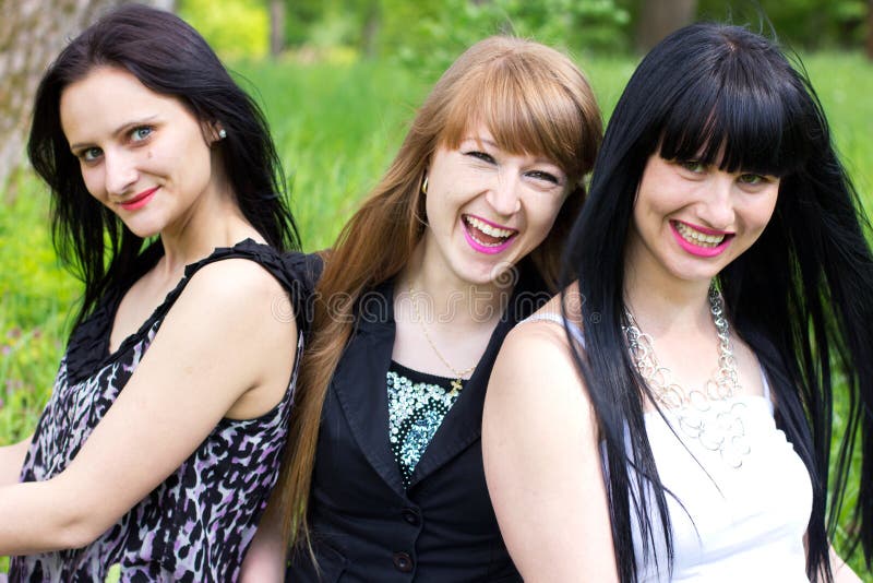 Three smiling girl-friends