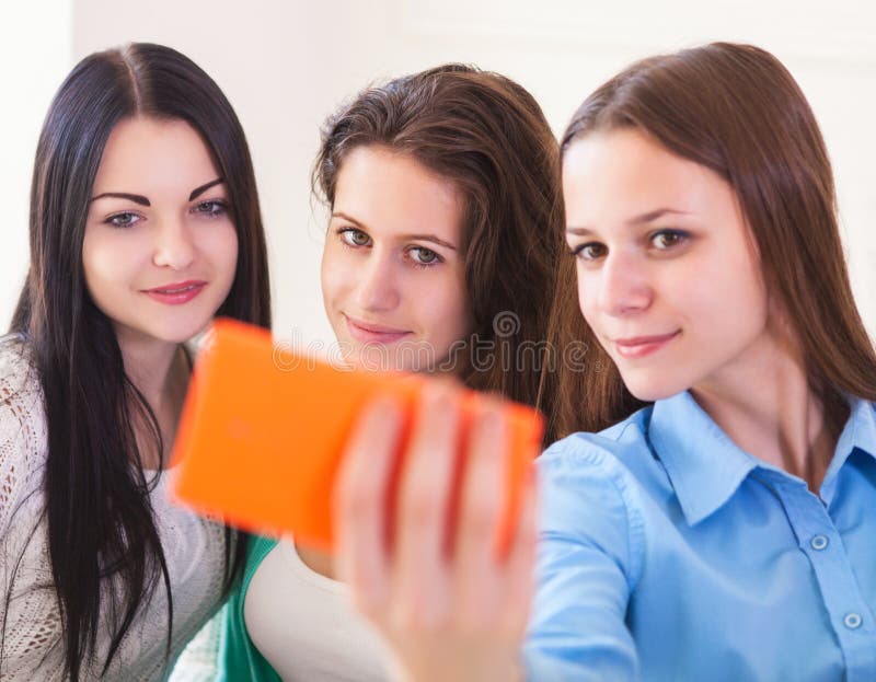 Three Smiling Teenage Girls Taking Selfie with Smartphone Camera Stock ...