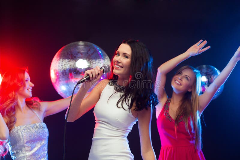 Three Smiling Women Dancing and Singing Karaoke Stock Image - Image of ...