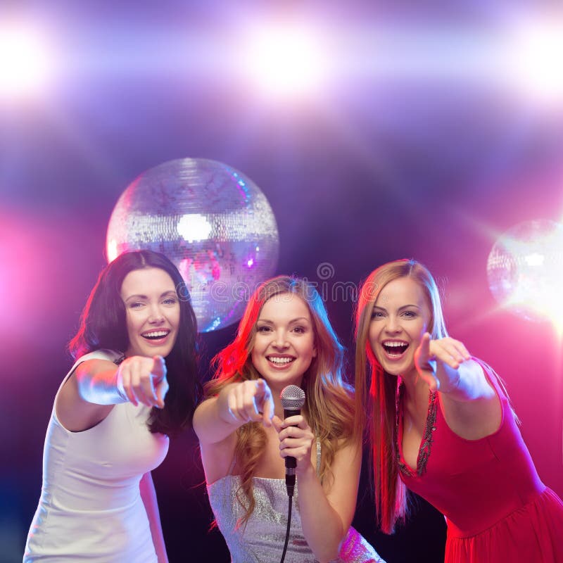 Three Smiling Women Dancing and Singing Karaoke Stock Photo - Image of ...
