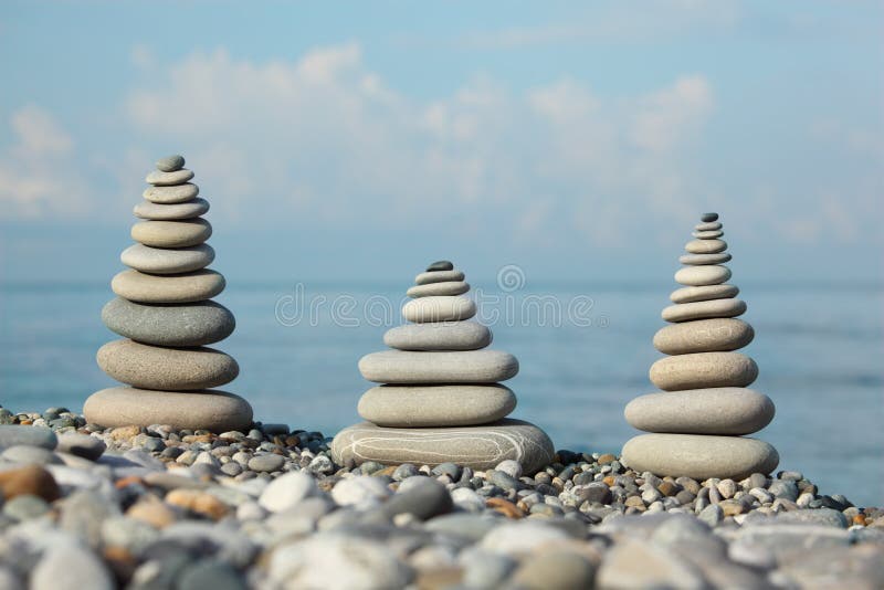 Three stone stacks on pebble beach