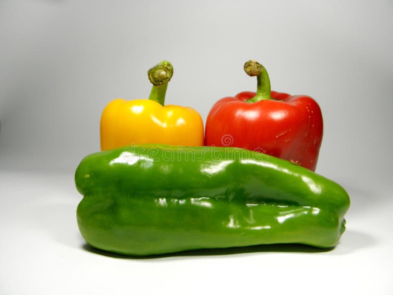 Three Sweet Peppers (red, Green, Yellow) Isolated on White Background