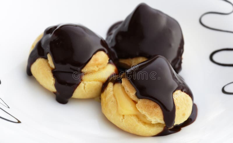 Three sweet profiterole stock images