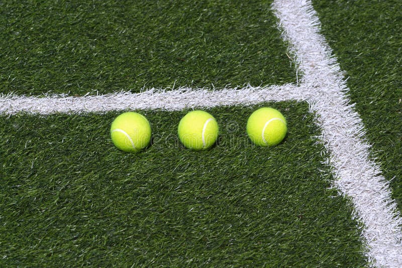 Three Tennis Balls on Green Court Stock Image Image of synthetic