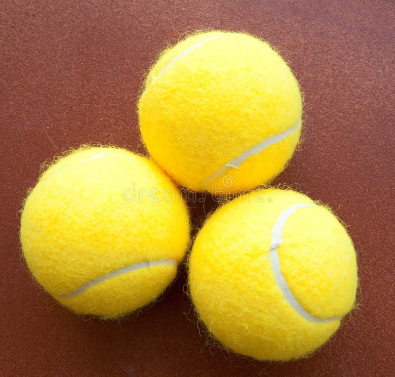 Three Tennis Balls Together in Yellow Stock Photo Image of inventory