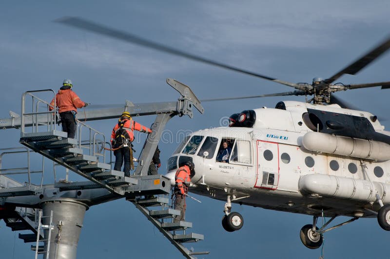 Three thumping assemblers under the helicopter