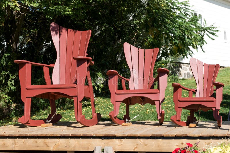 Three Adirondack chairs in different sizes. Canada