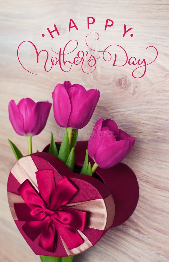 Three tulip in red gift box in form of heart and text Happy mothers day. Calligraphy lettering hand draw