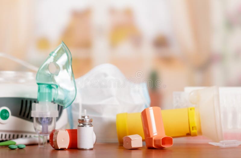 Three types of inhalers - mesh nebulizer, a compressor and a small portable on table stock photos