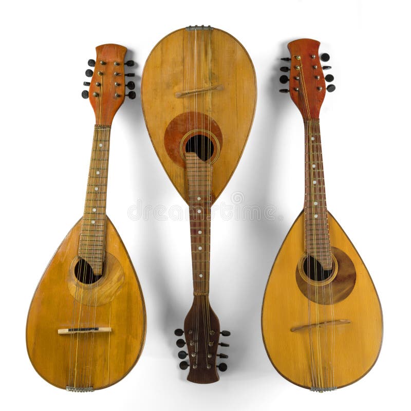 Three vintage mandolins. Isolated on a white background. royalty free stock photos Three vintage mandolins. Isolated on a white background. royalty free stock photos