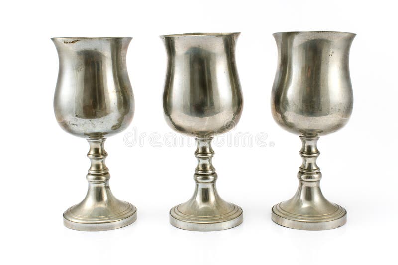 Three vintage silver plated goblets isolated on white