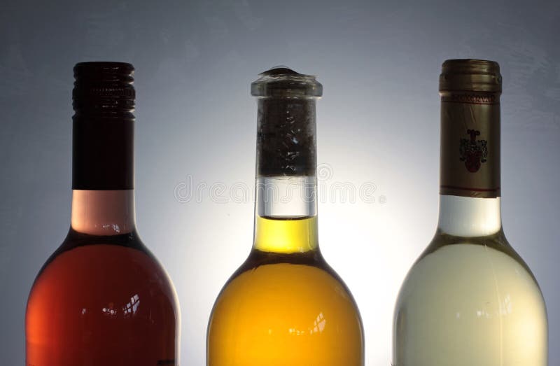 Three wine bottles with backlight