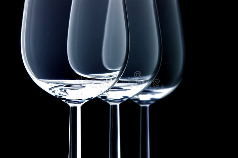 Three wine glasses on black background