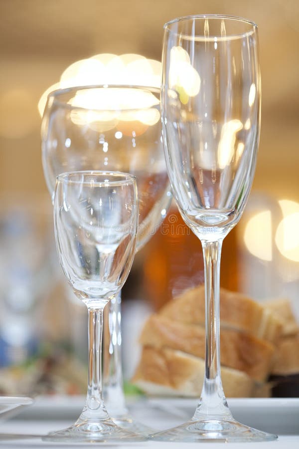 Three wine glasses on a white festive table. Three wine glasses on a white festive table