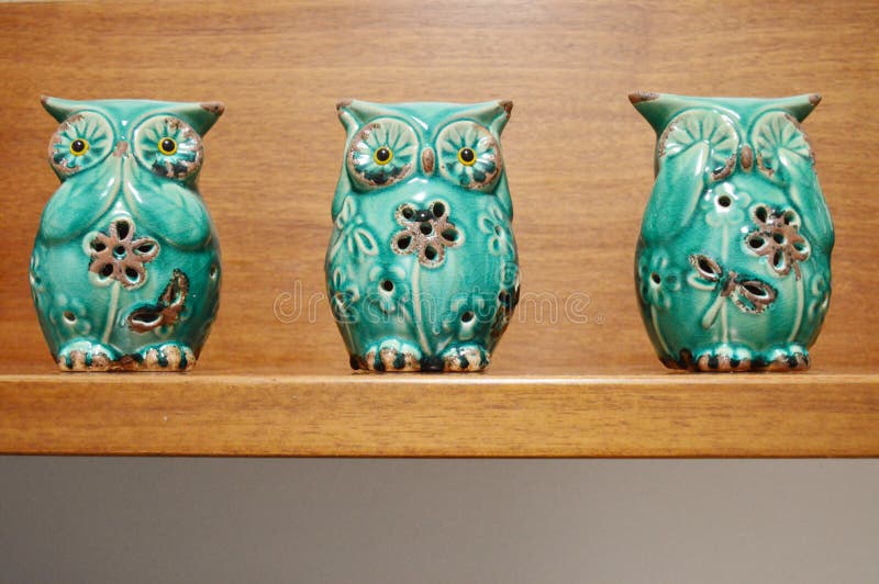 Three wise owls statuettes stock image. Image of wood 67674529
