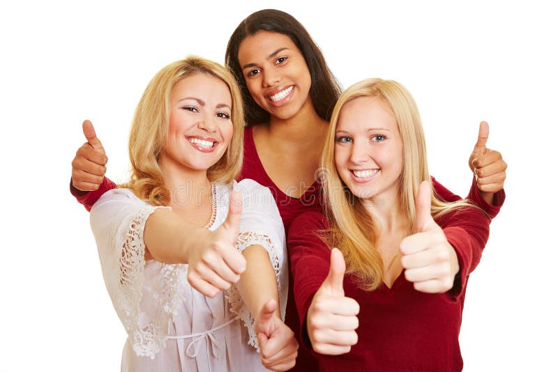 Three women holding thumbs up royalty free stock photo