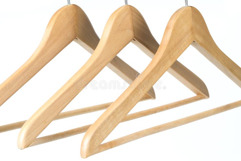 Three Empty Wooden Coat /clothes Hangers on a Clothes Rail Stock Image