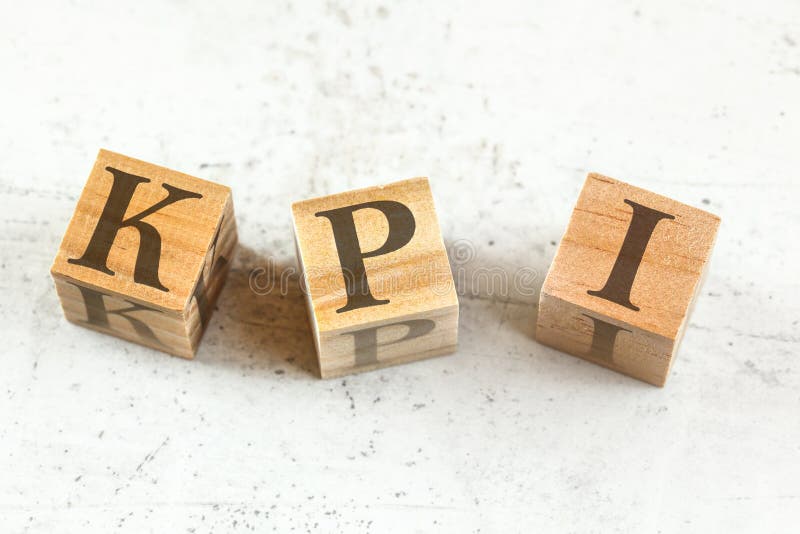 Three Wooden Cubes with Letters KPI Stands for Key Performance