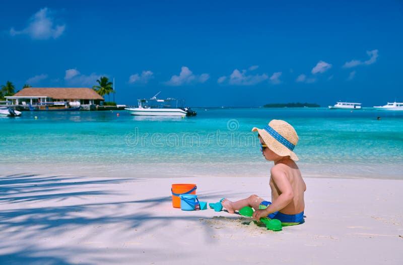 Three year old toddler playing on beach royalty free stock image Three year old toddler playing on beach royalty free stock image
