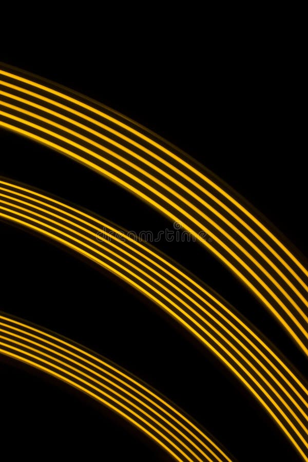 Three yellow curve and dynamic light lines on a black background. Three yellow curve and dynamic light lines on a black background