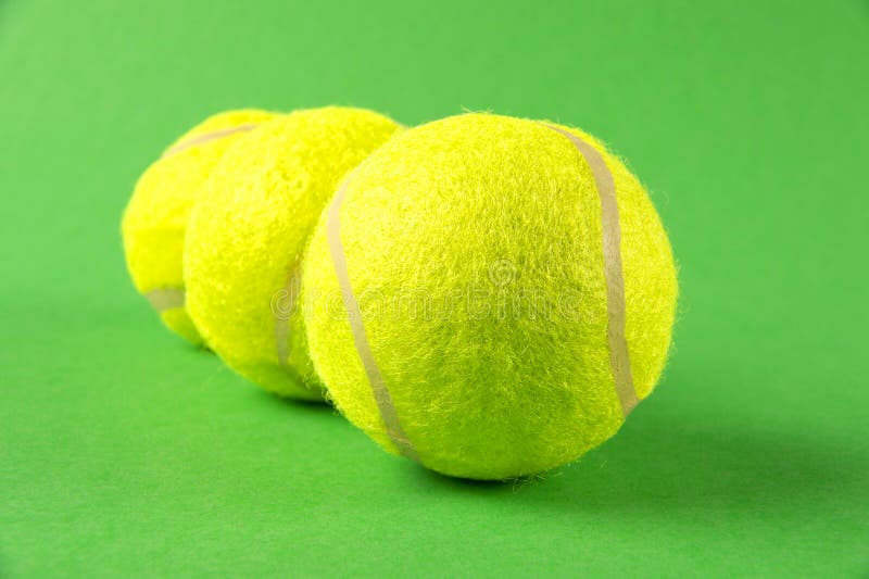 Three Yellow Tennis Balls on Green Background Stock Image Image of sporting, selective 28936375