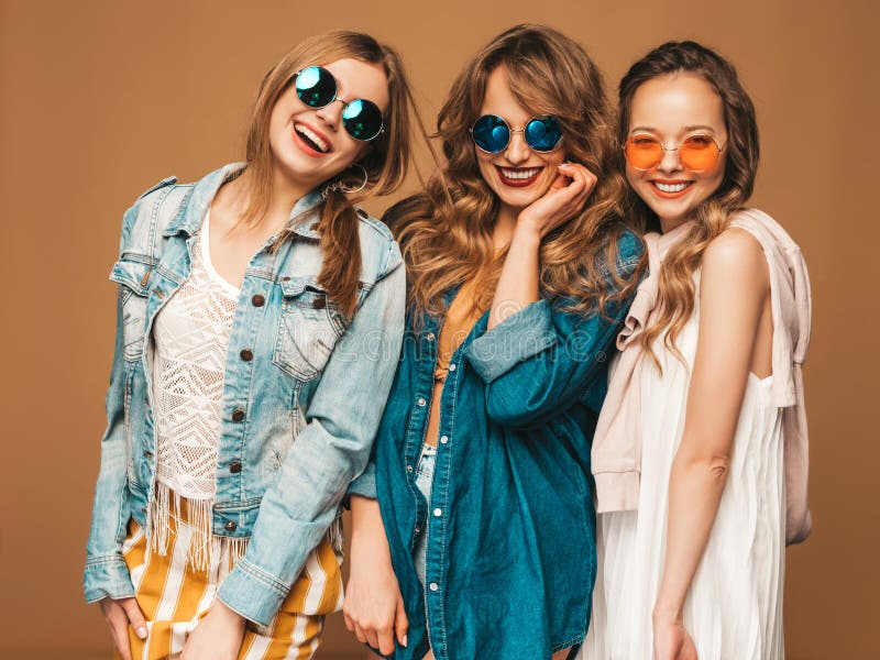 Three Young Beautiful Hipster Girls in Trendy Clothes in Studio Stock ...