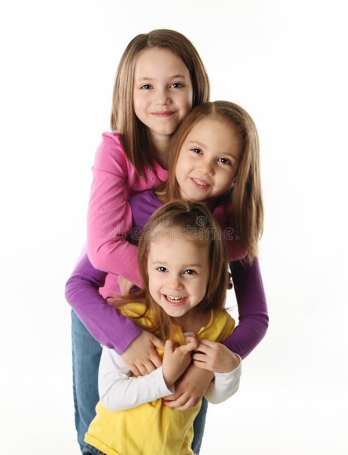 Three Young Sisters Having Fun Stock Photo Image of isolated, pink