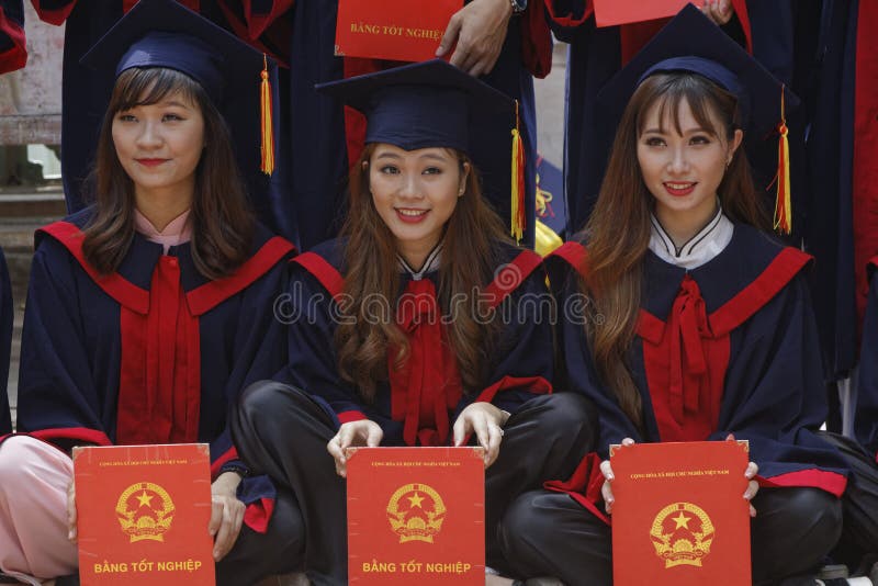 Three young students with their diploma