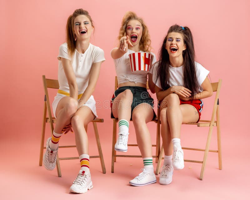 Were out spreading some 80s vibes. Studio shot of two beautiful young women  styled in 80s clothing. Stock Photo by YuriArcursPeopleimages