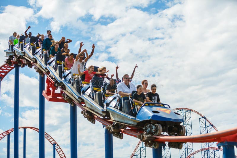 Thrillseekers ride the roller coaster at a local amusement park for Family Fun Day at Six Flags in Maryland. Thrillseekers ride the roller coaster at a local amusement park for Family Fun Day at Six Flags in Maryland.