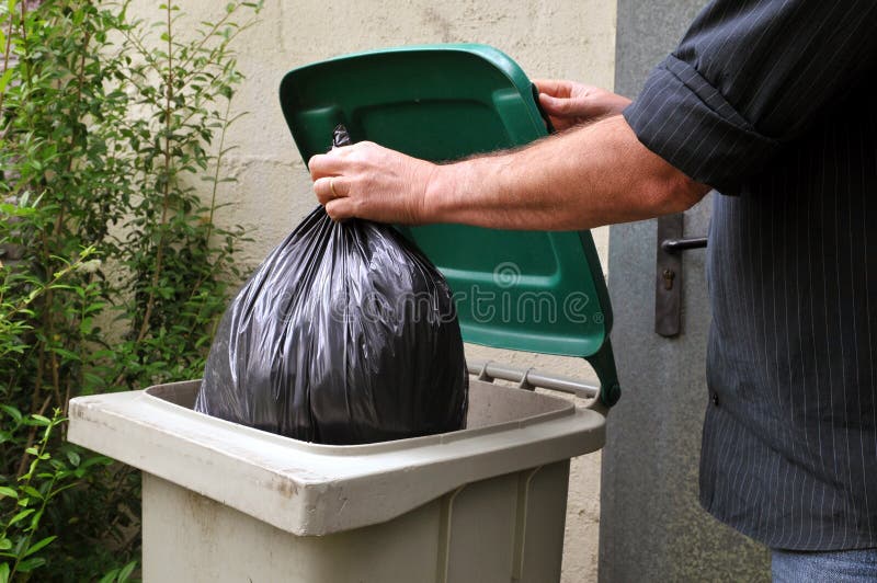 Throw a plastic bag in the trash stock photography Throw a plastic bag in the trash stock photography