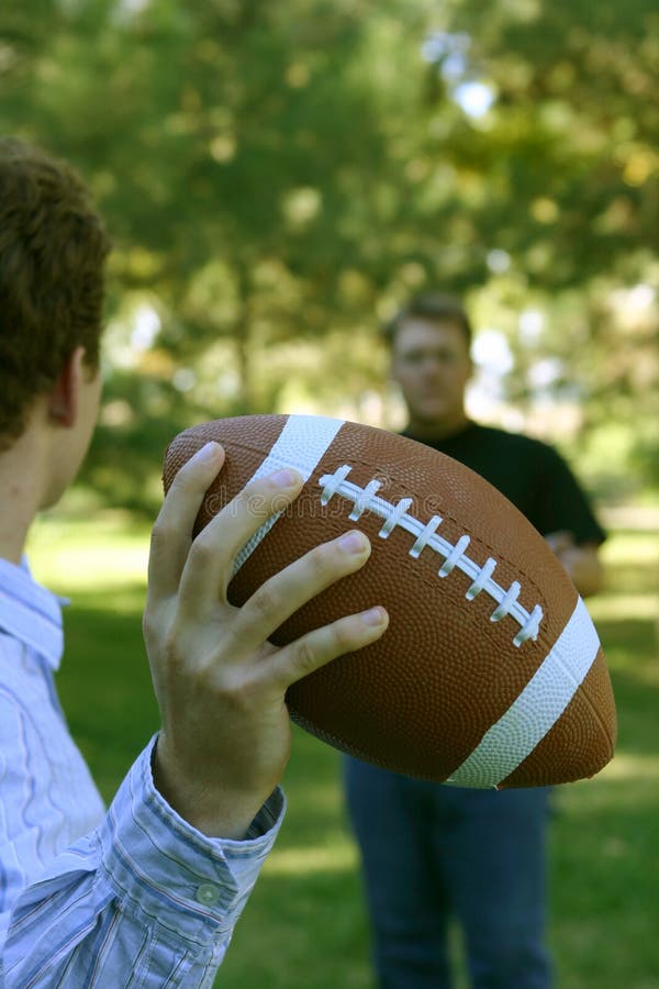 Throwing the football stock photo. Image of playing, people 38770