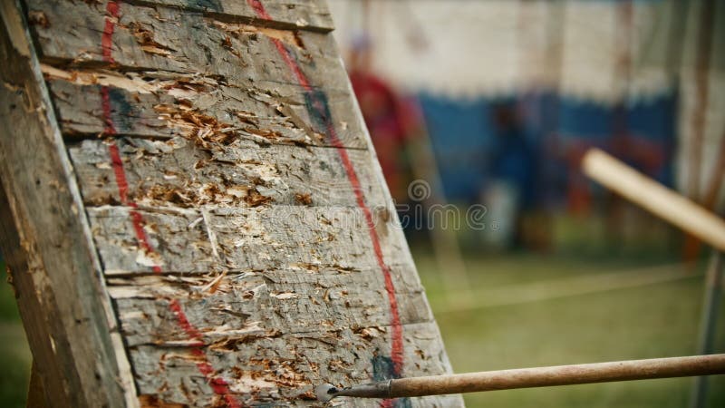 Throwing a spear in the wooden target outdoors