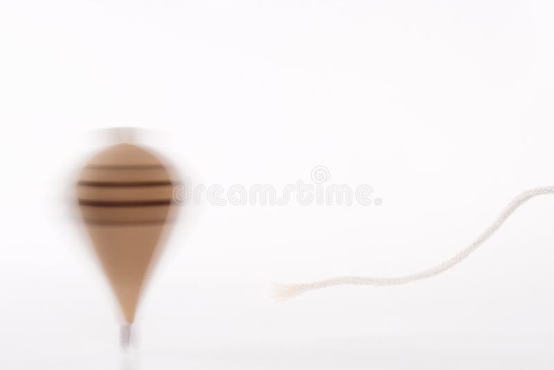 Throwing a spinning top stock photo. Image of wood, spinning 33478594