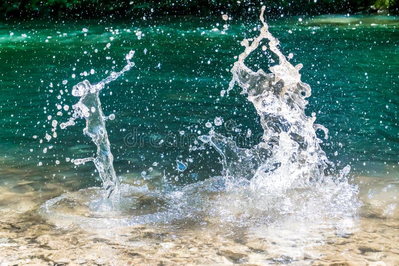 Splash Water. Throwing Stones in a Clean Mountain River Stock Photo ...