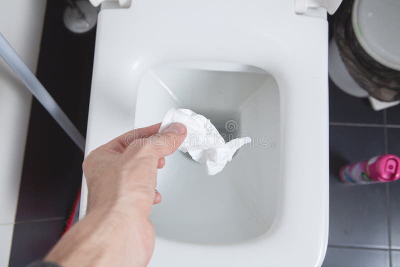 Throws a Napkin Down the Toilet Stock Photo Image of people, towels