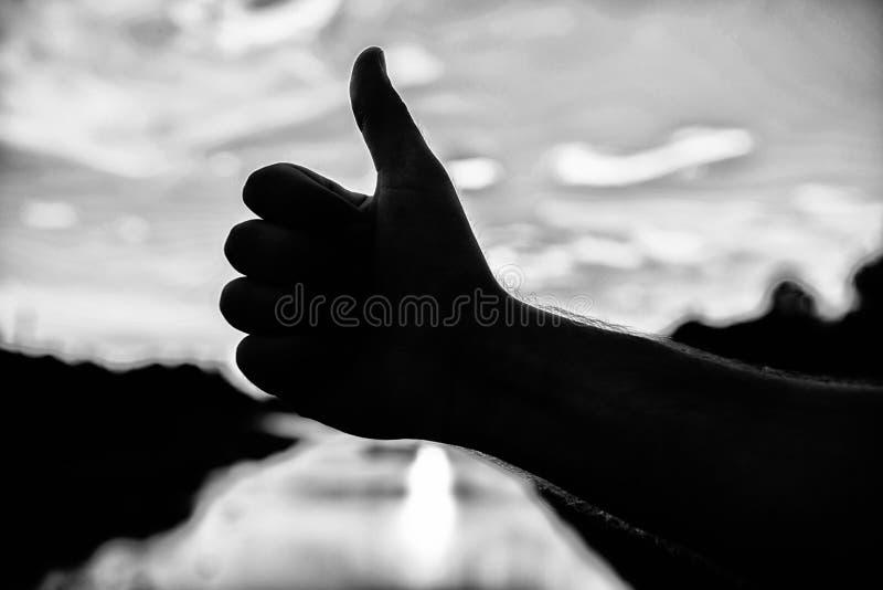 Thumbs up gesture sign of best choice approve and accept. Top places to visit in evening. Silhouette thumb up gesture in stock photos Thumbs up gesture sign of best choice approve and accept. Top places to visit in evening. Silhouette thumb up gesture in stock photos