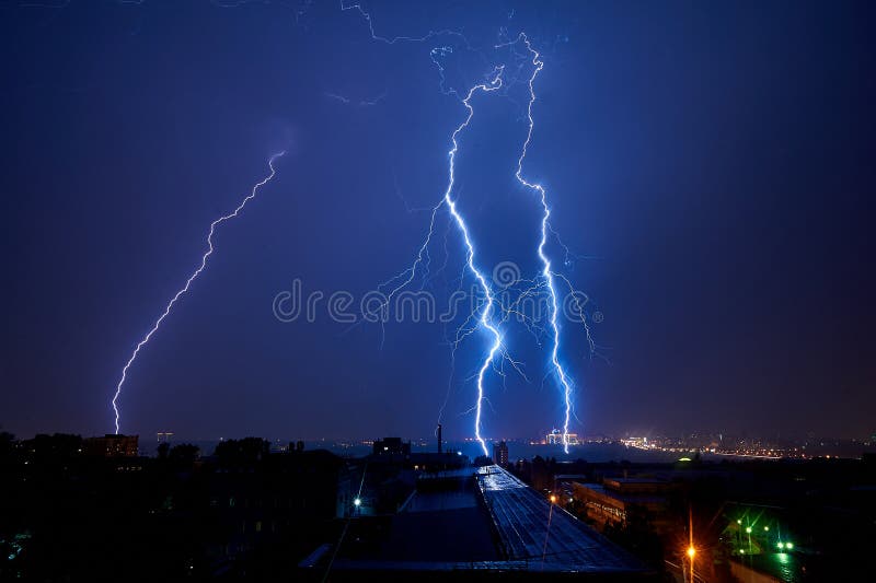 Thunderstorm in the city at night lightning dark summer beauty