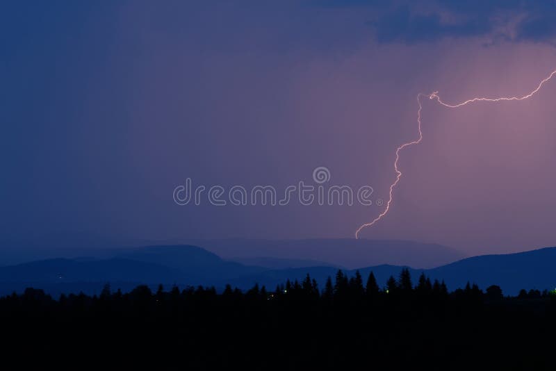 Thunderstorm with lightning on the mountain. Dramatic, nature.