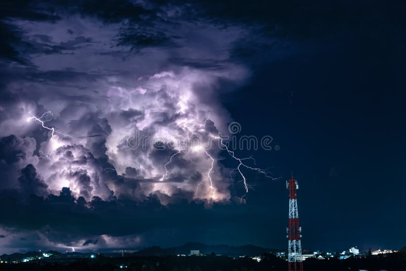 Forked Lightning Over The Cell Phone Antenna Tower At Night Stock Image