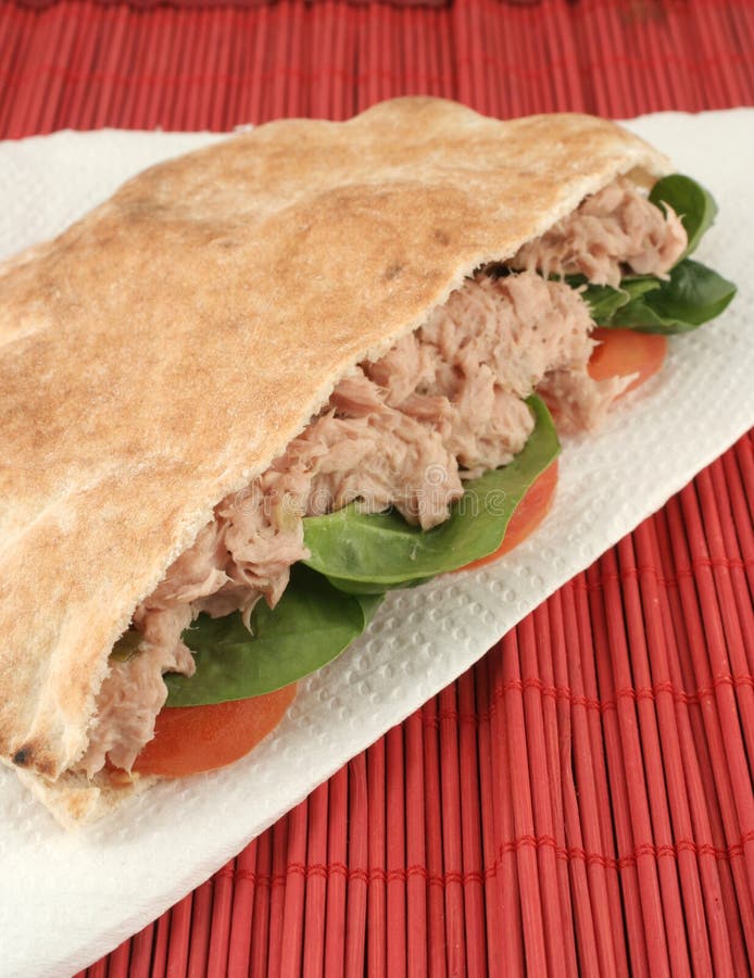 Tuna with spinach and tomato in a whole wheat pita. Tuna with spinach and tomato in a whole wheat pita