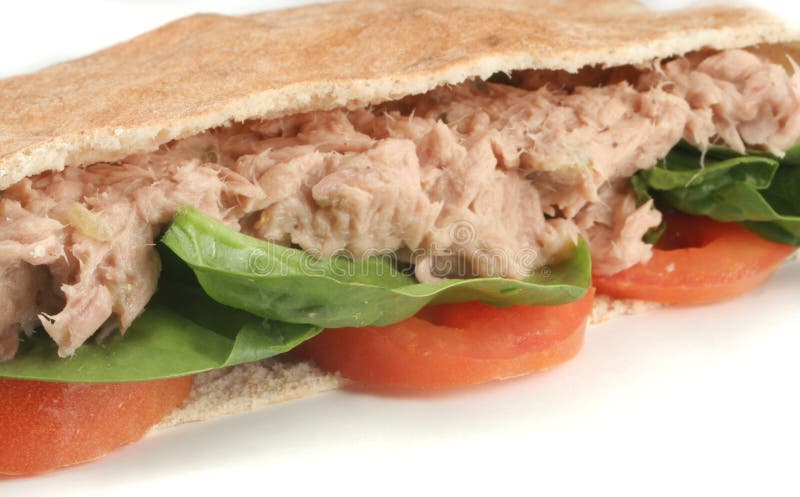 Tuna with spinach and tomato in a whole wheat pita. Tuna with spinach and tomato in a whole wheat pita