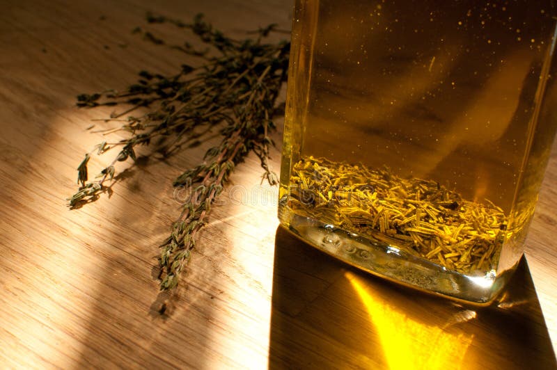 Thyme flavored olive oil stock image. Image of container 32496243