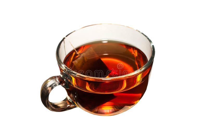 Thé dans la tasse en verre sur le fond blanc d'isolement image stock Thé dans la tasse en verre sur le fond blanc d'isolement image stock