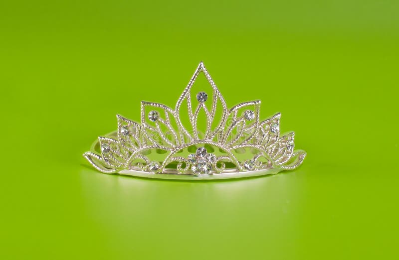 Tiara or diadem with reflection on green stock photo Tiara or diadem with reflection on green stock photo