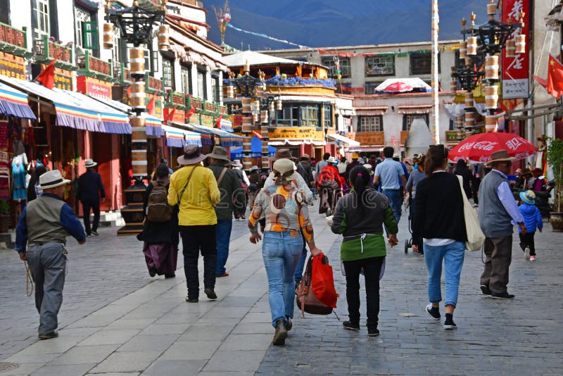 Tibet, Lhasa, China, June, 02, 2018. People walking along the ancient Barkhor street Bakuo W street in summer day in cloudy we royalty free stock photography Tibet, Lhasa, China, June, 02, 2018. People walking along the ancient Barkhor street Bakuo W street in summer day in cloudy we royalty free stock photography