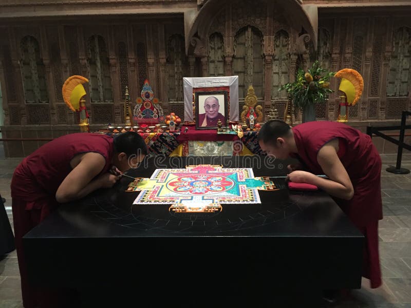 Dallas, TX 2016, April: Tibetan Buddhist Monks spent a week in residence painstakingly creating a colorful sand mandala. The mandala is then ceremonially destroyed to demonstrate the impermanence of our existence. An altar with a photo of the Dalai Lama was erected in the room. Dallas, TX 2016, April: Tibetan Buddhist Monks spent a week in residence painstakingly creating a colorful sand mandala. The mandala is then ceremonially destroyed to demonstrate the impermanence of our existence. An altar with a photo of the Dalai Lama was erected in the room.